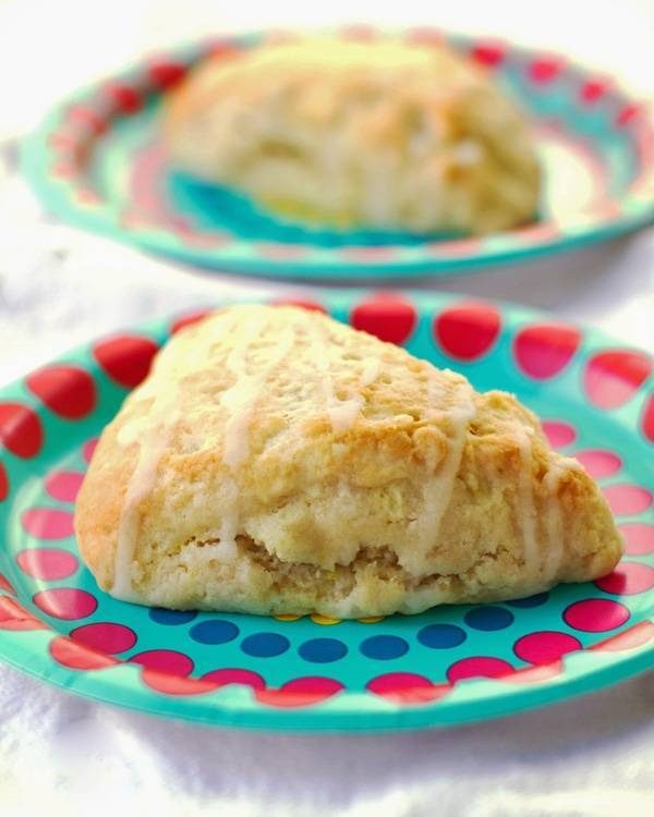 Citrus scones on colorful plates.