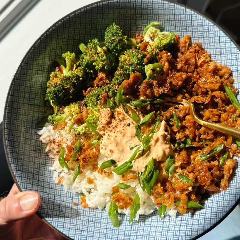 Teriyaki tofu bowls in a bowl with rice, broccoli, and kimchi mayo.